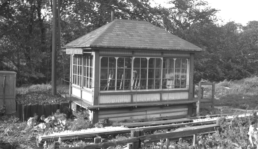 Little Eaton Station signal box photographed from the south east over the boundary fence, showing its non-steps end about 1965 by Pat Larkam - MRSC collection
