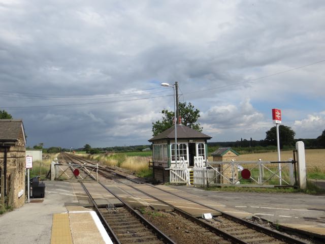 A view of Swinderby signal box from the down platform looking toward Lincoln